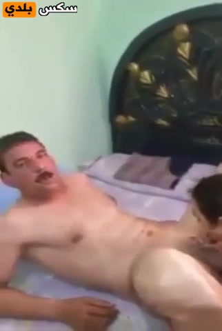 Arab man relaxes in bed with neighbor