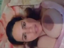 Tempting MILF shows off huge tits and wet vagina
