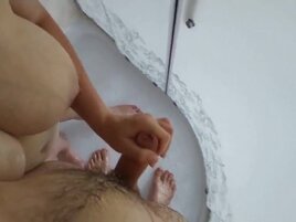 Nude German MILF strokes hubby's cock in the shower