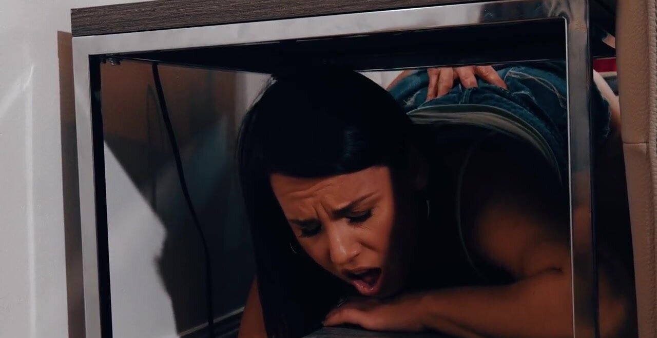 Boy fools around with the stuck under table chick