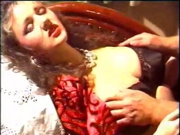 Man plays with big tits of the vintage pornstar