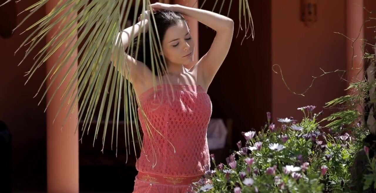 Girl with black hair masturbates outdoors
