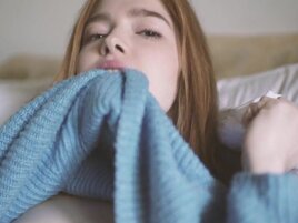 Adorable red-haired babe sticks dildo into trimmed cunt