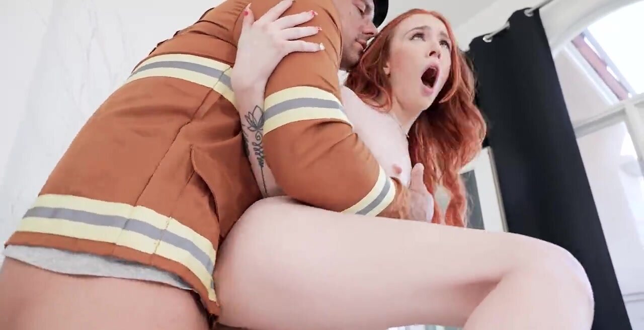 Gorgeous pale redhead is fucking the fireman