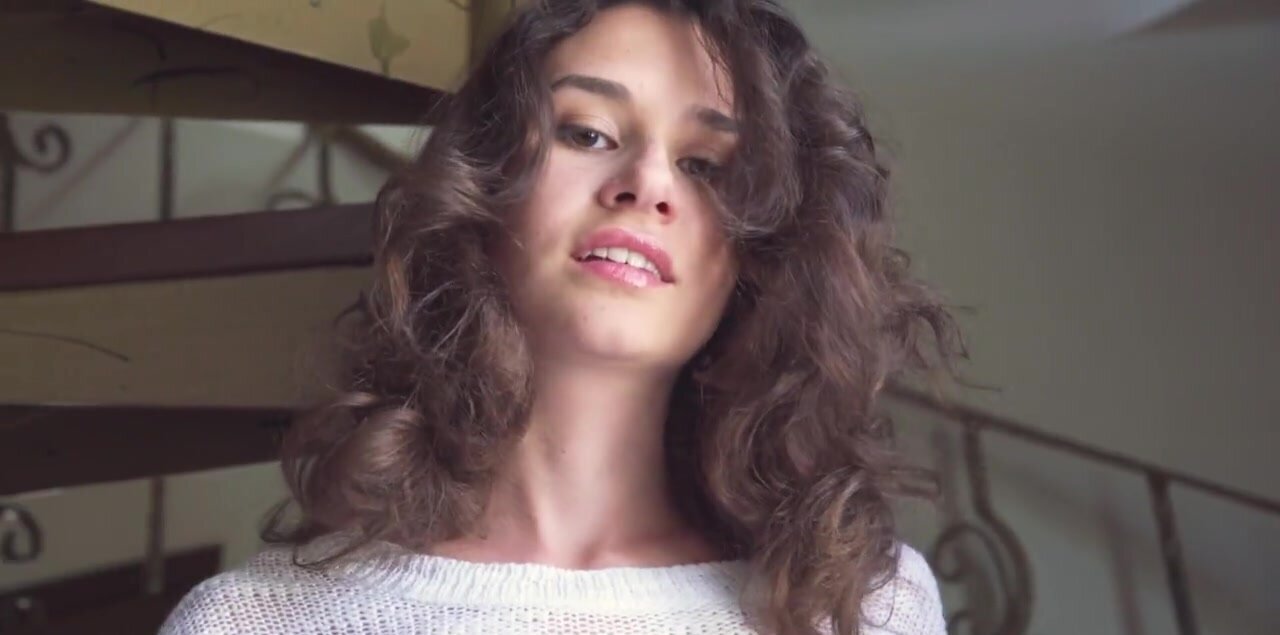 Taking off her conservative outfit before masturbating