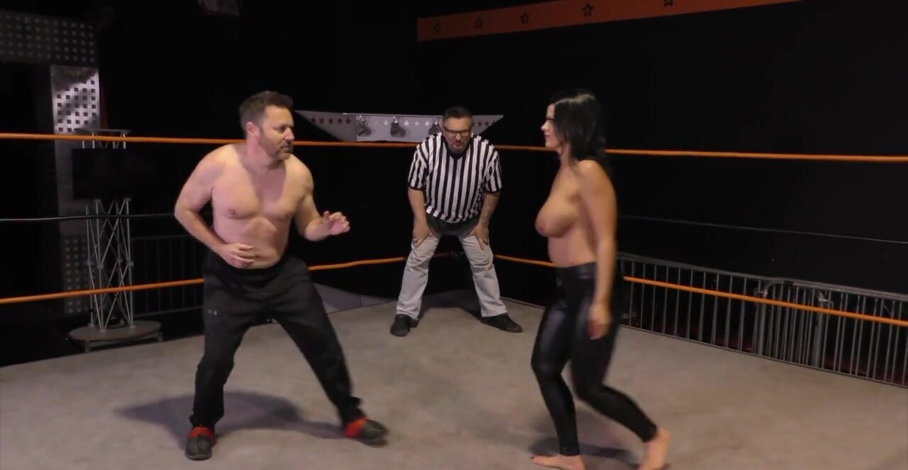 Nadia White wrestling with Glenn King in a fetish clip