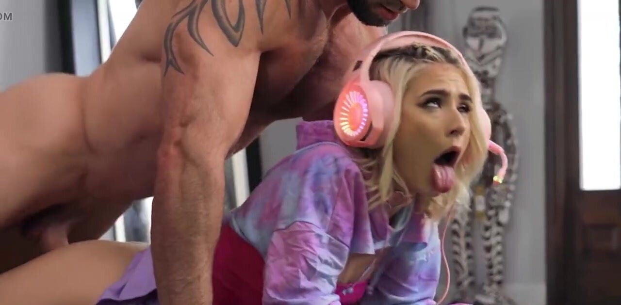 Jessie Saint playing video games while Danny Steele bangs her