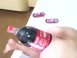 Huge bottle of Coke gaping her submissive asshole
