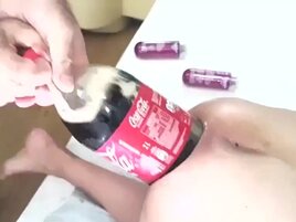 Huge bottle of Coke gaping her submissive asshole