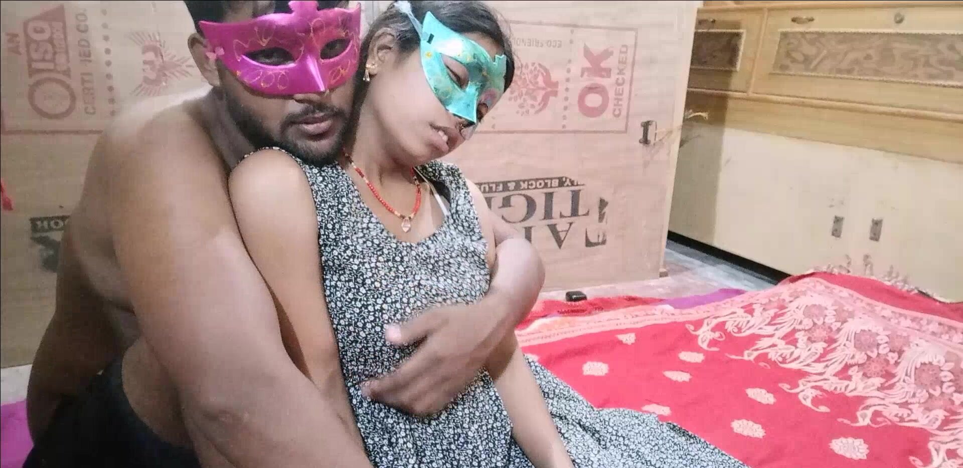 Two masked people from India are making a sex tape
