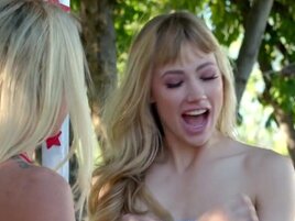 Lezzie blonde model fingers pussies by the kissing booth