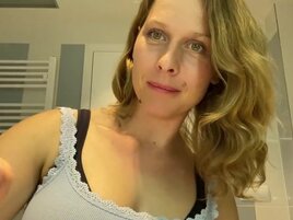 Ugly mom fondles her boobs while putting her make up on