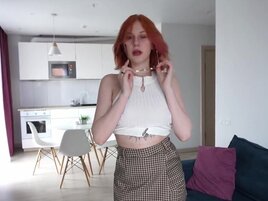 Redheaded hottie looks great as she takes his boner