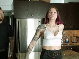Inked babe and a tattooed stud are doing it in the kitchen