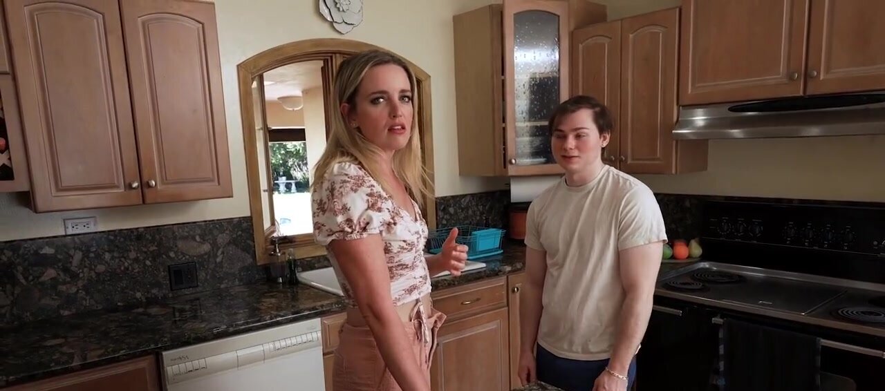 A blonde MILF is taking care of two dicks at once