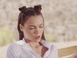 Brunette with cute spacebuns masturbates outdoors
