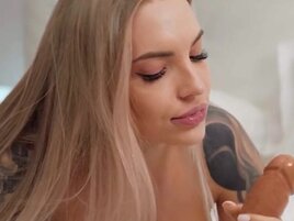 Skinny blonde with great feet is pleasing a dildo