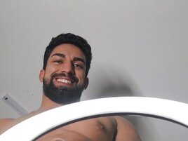 Bearded man making an OnlyFans video with his partner