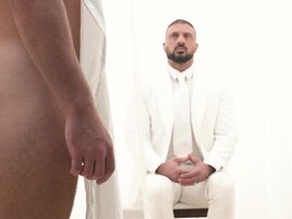 A man in a suit is banging the hell out of a petite lad
