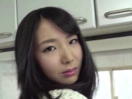 Japanese babe is getting fingered in the kitchen first