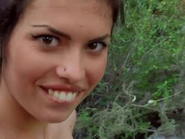 Brunette looks great while smacking her own ass in the woods