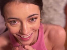 Kylie Quinn on her knees and smiling for a cock